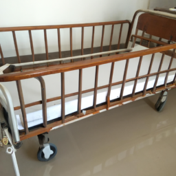 manual wooden and steel hospital bed